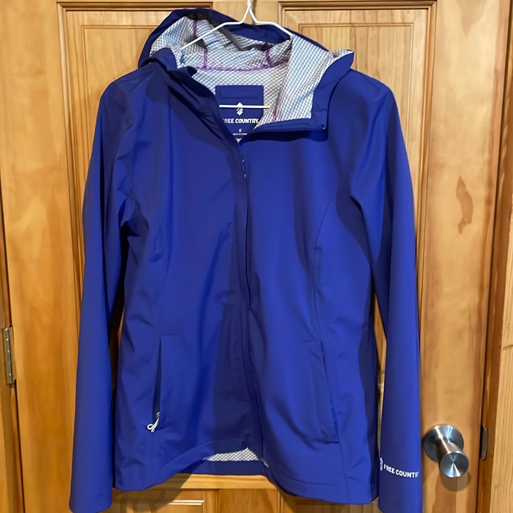 Women’s raincoat, size small, color is purple.